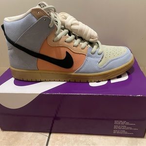 The Nike SB Dunk High Spectrum features a multicolor, black, and Gum suede